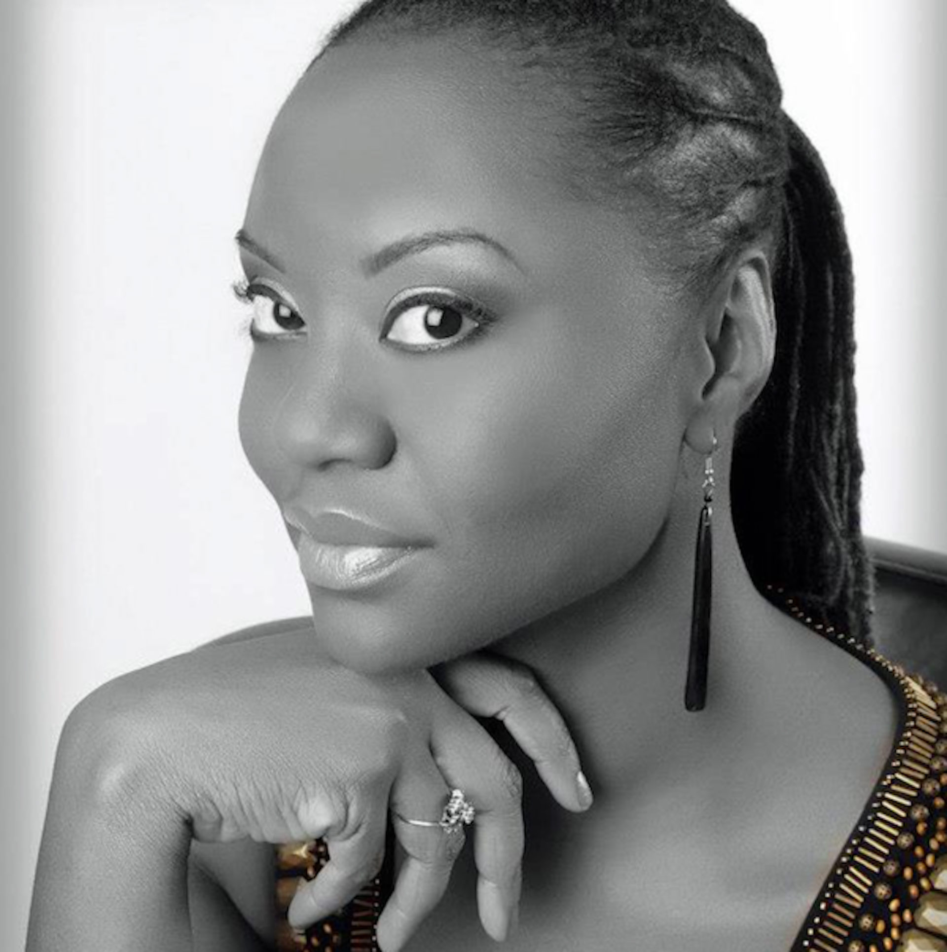 Black and white portrait photo of Mai Perkins, the facilitator.