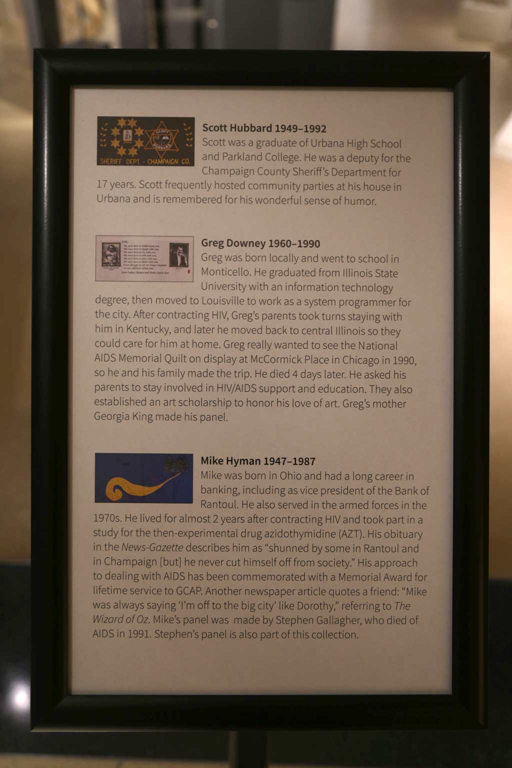 A plaque with images of quilt panels and corresponding information