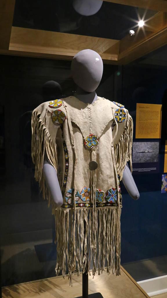mannequin wearing beaded shirt
