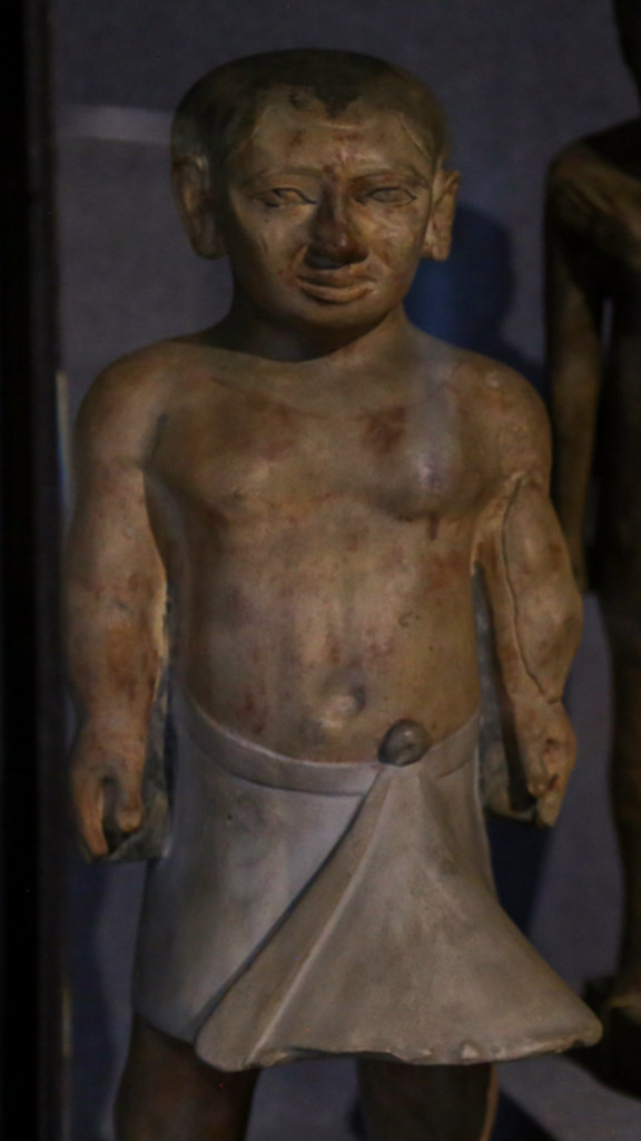 statue of the dwarf Khnumnotep, depicitng a short man