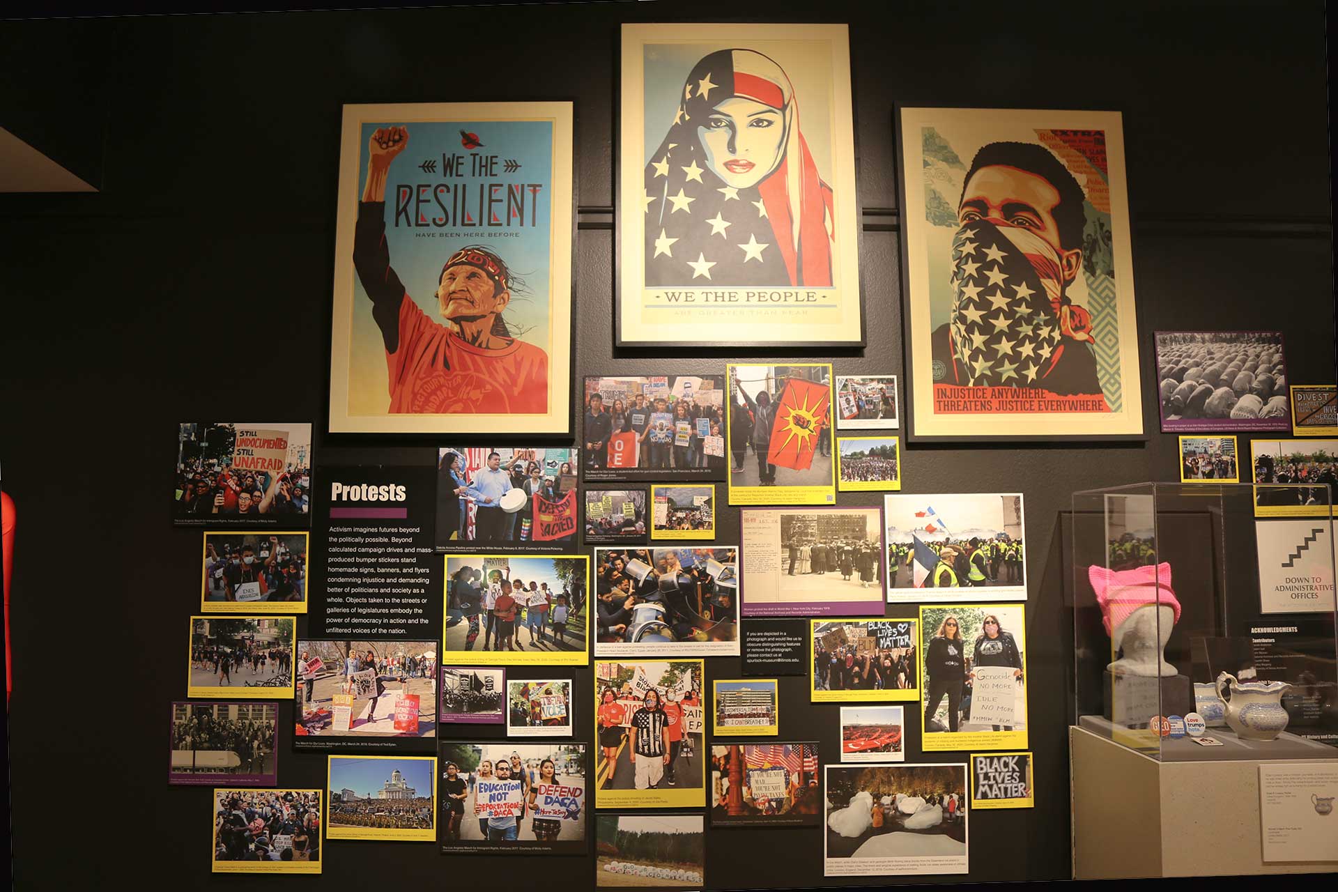 wall of posters including some from the BLM movement