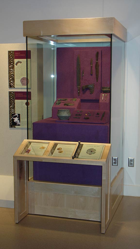 right leaning perspective of the previous display stand and text description about the artifacts inside