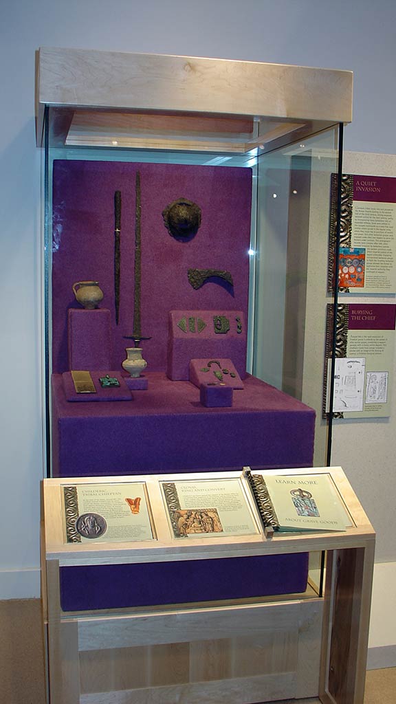 left leaning perspective of the previous display stand and text description about the artifacts inside
