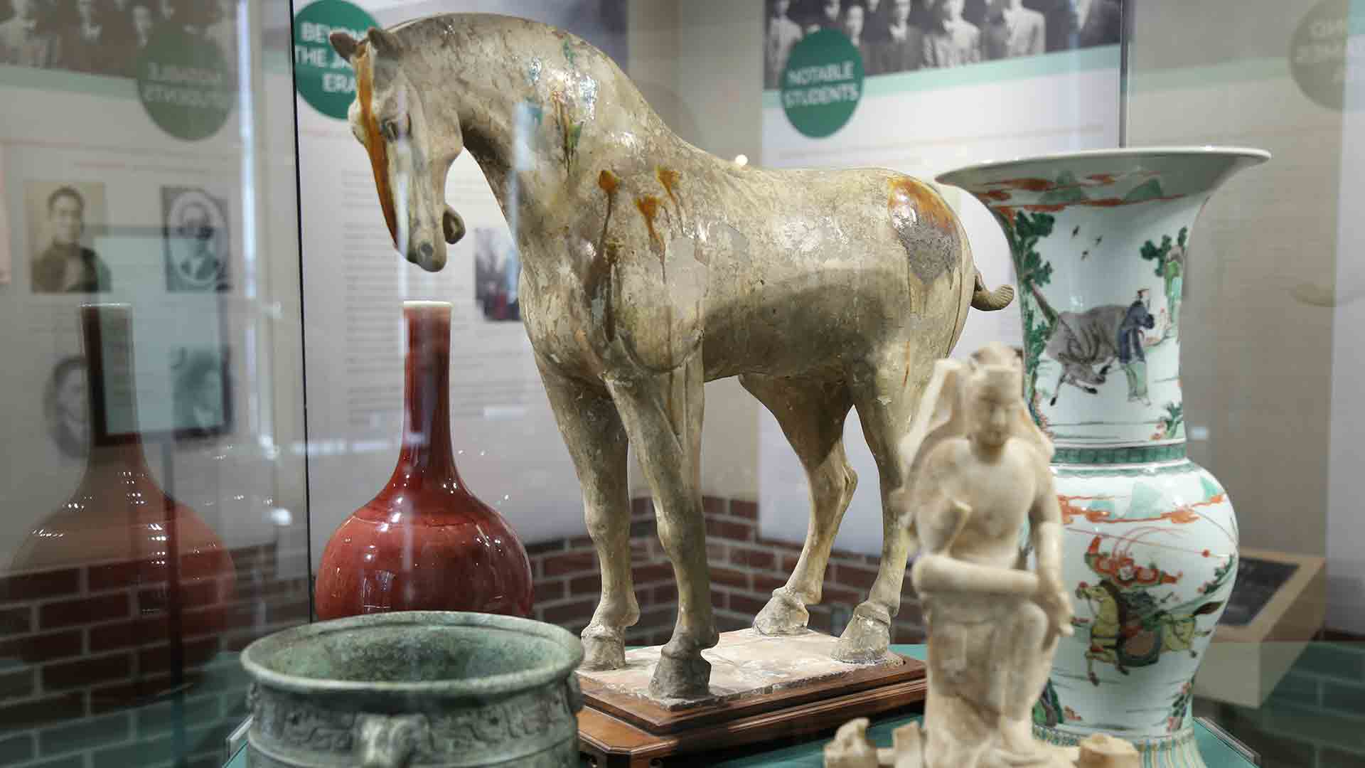 right side of china potteries, sculptures of horse and Chinese god, greencopper container