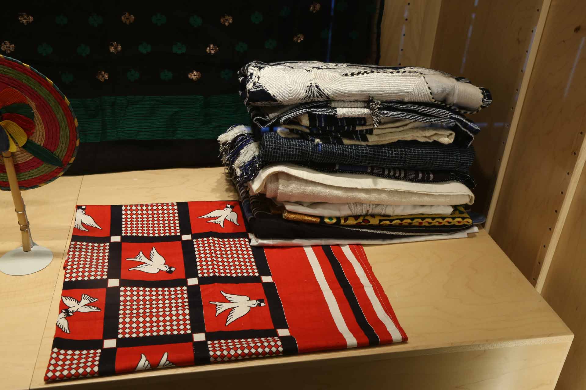 folded cloths with designs on them