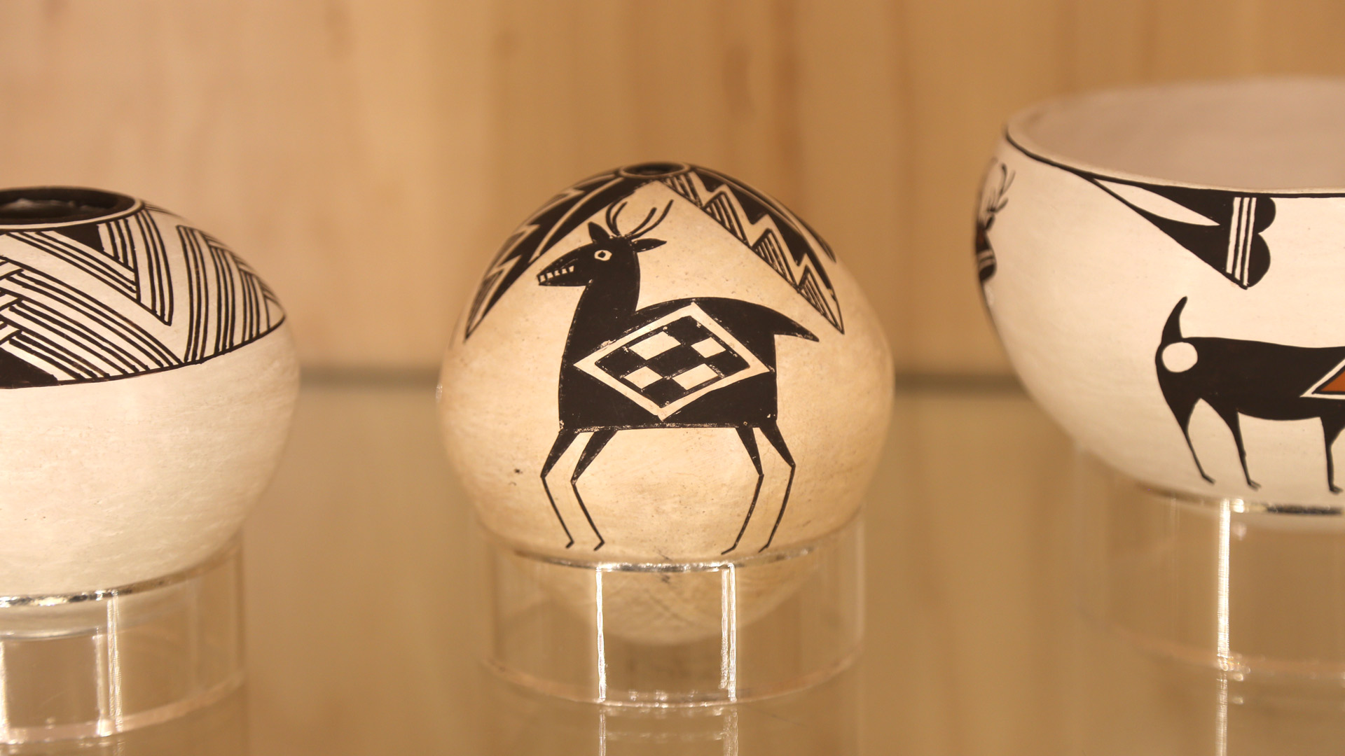 closeup of a seed pot with a painting of a deer