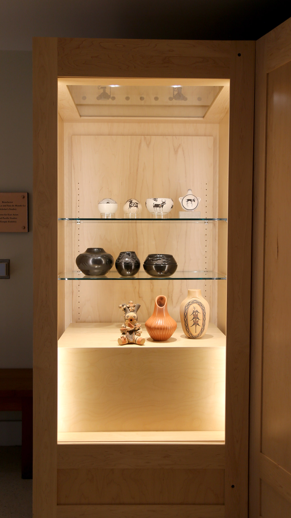 a full, vertical shot of the left case featuring pottery