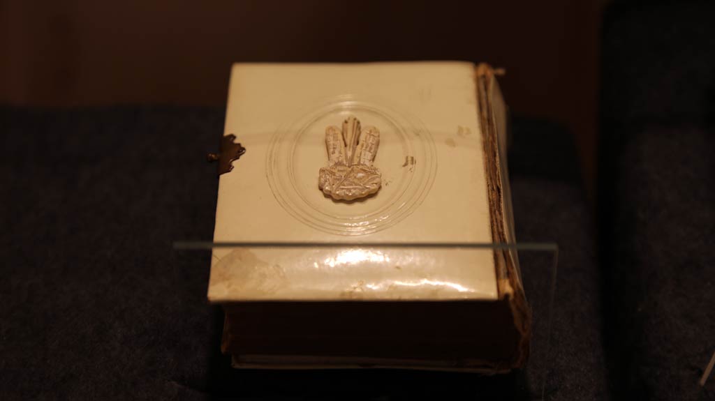a book with carved shape that looks like a rabbit with three ears