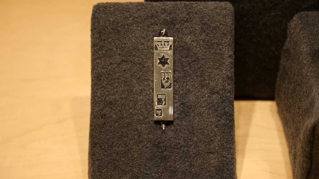 metal object with symbols like stars and other shapes