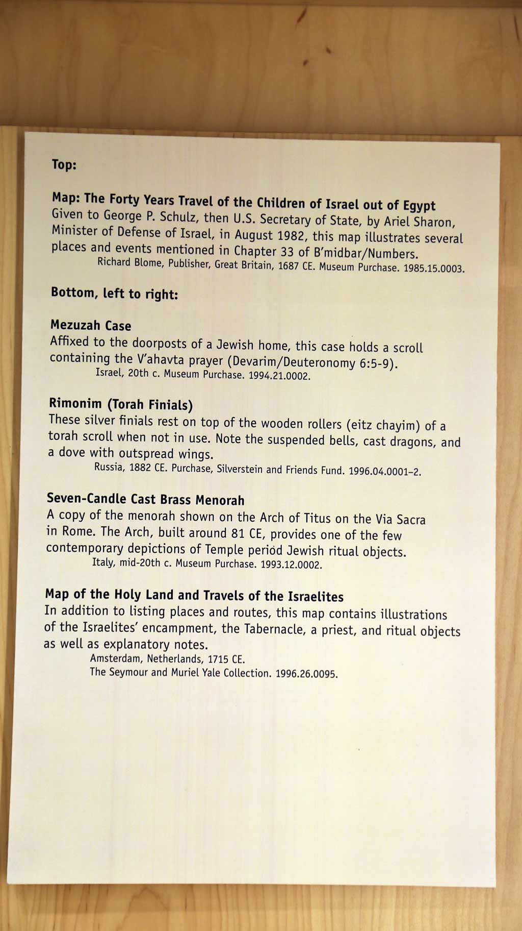 texts description on the wall of Map, Rimonim, Seven-candle Cast Brass Menorah, Map of the holy land and travels of the Israelites