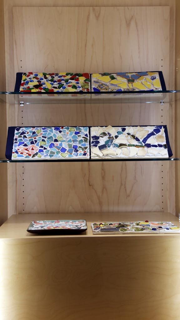 a vertical shot of the left case showcasing all of its objects which are similar in general theme to the first case
