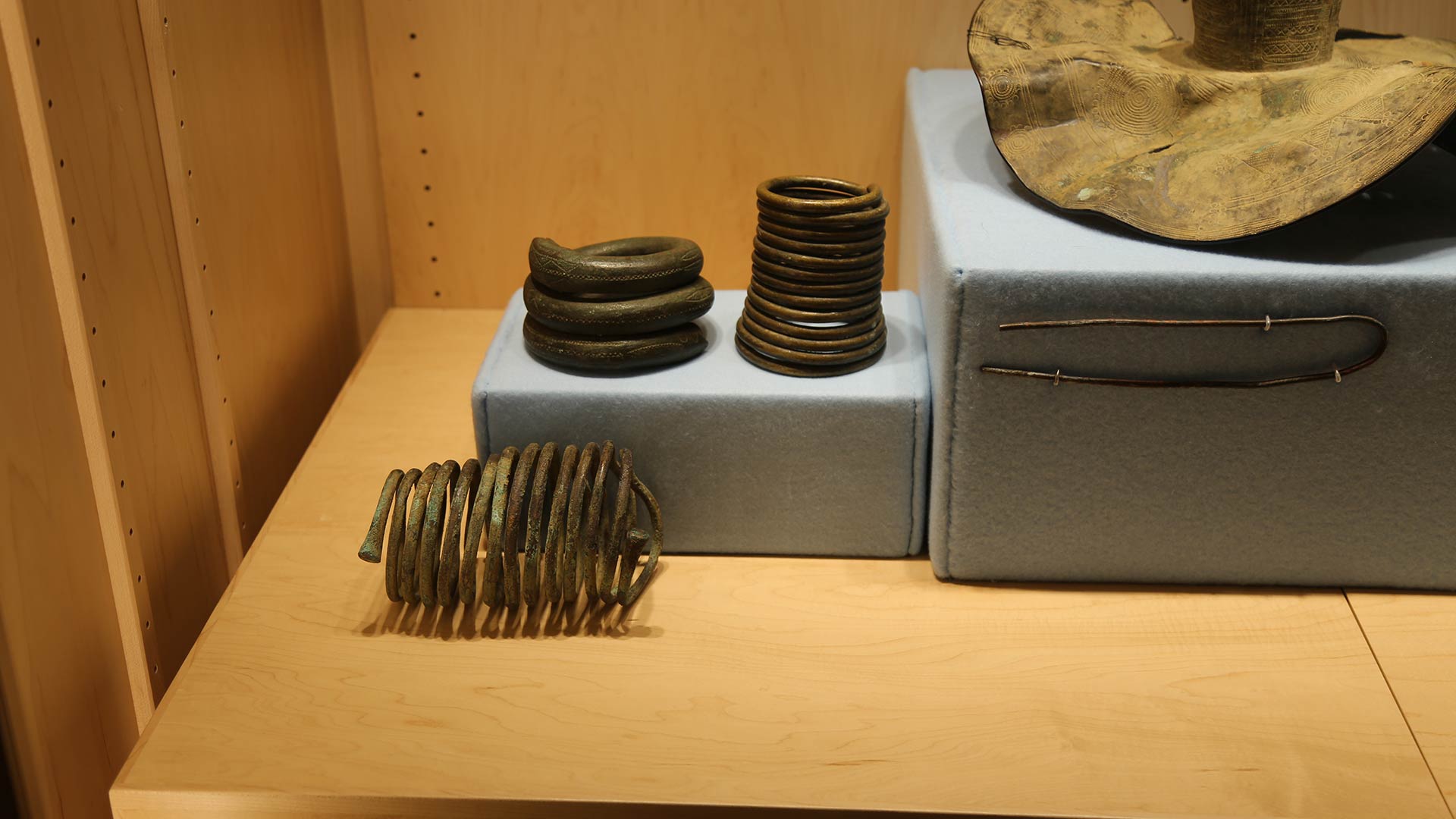metal coils and Raffia cloth