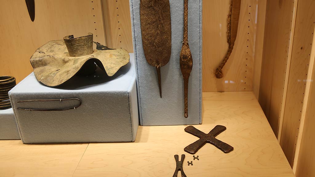 several objects with pointy ends next to a Raffia cloth
