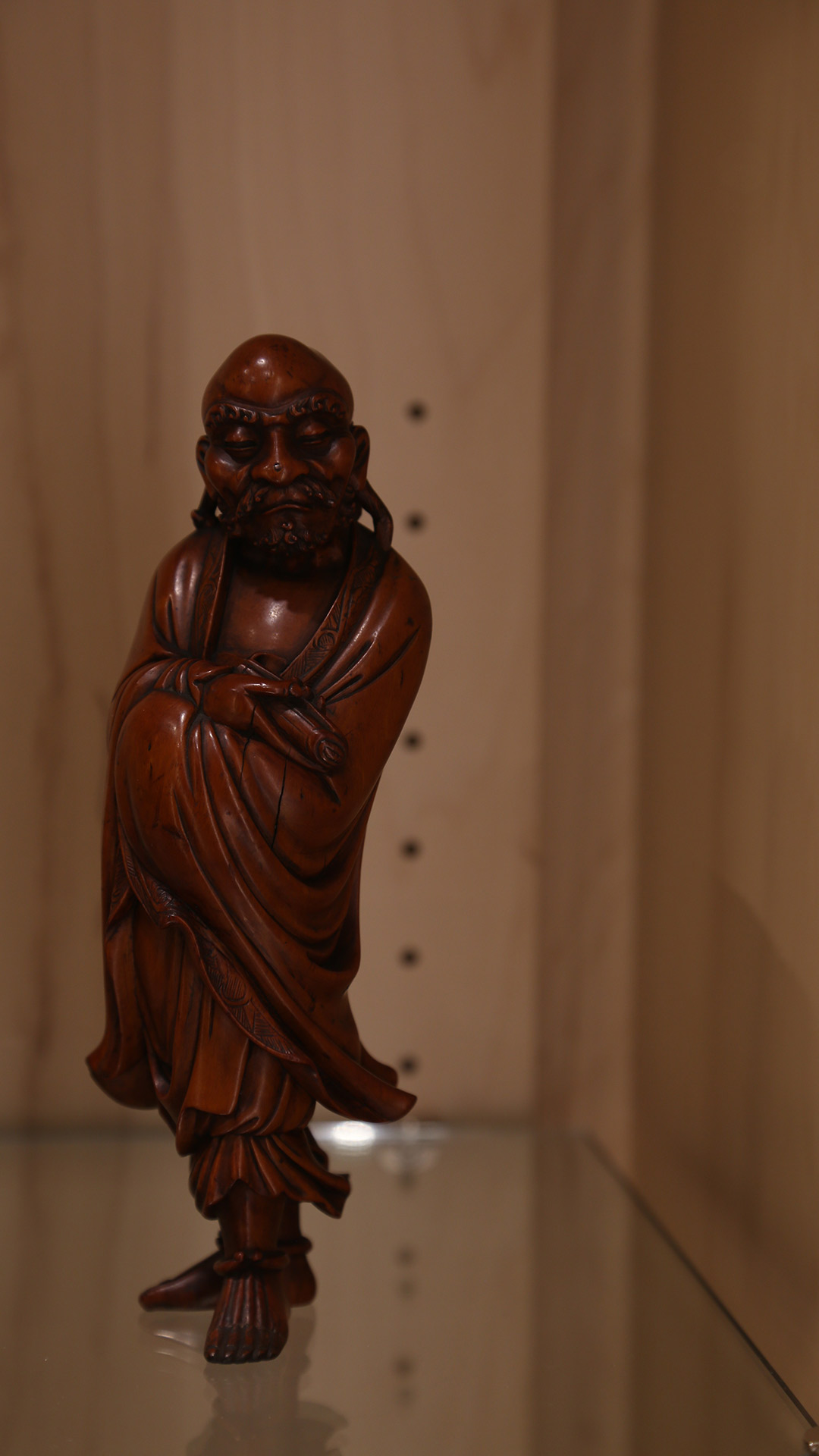 close-up of a robed man standing in a pose