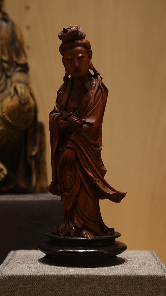 close-up of a smiling robed man