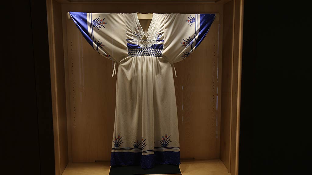 a white and blue silky dress
