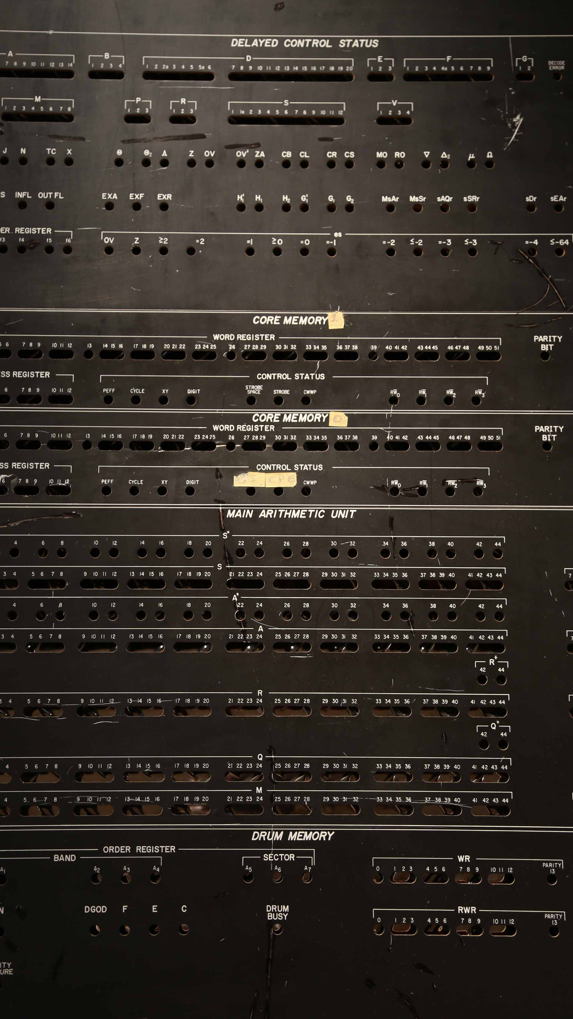 close-up of what appears to be a early computer, tall black and many different spots for switches