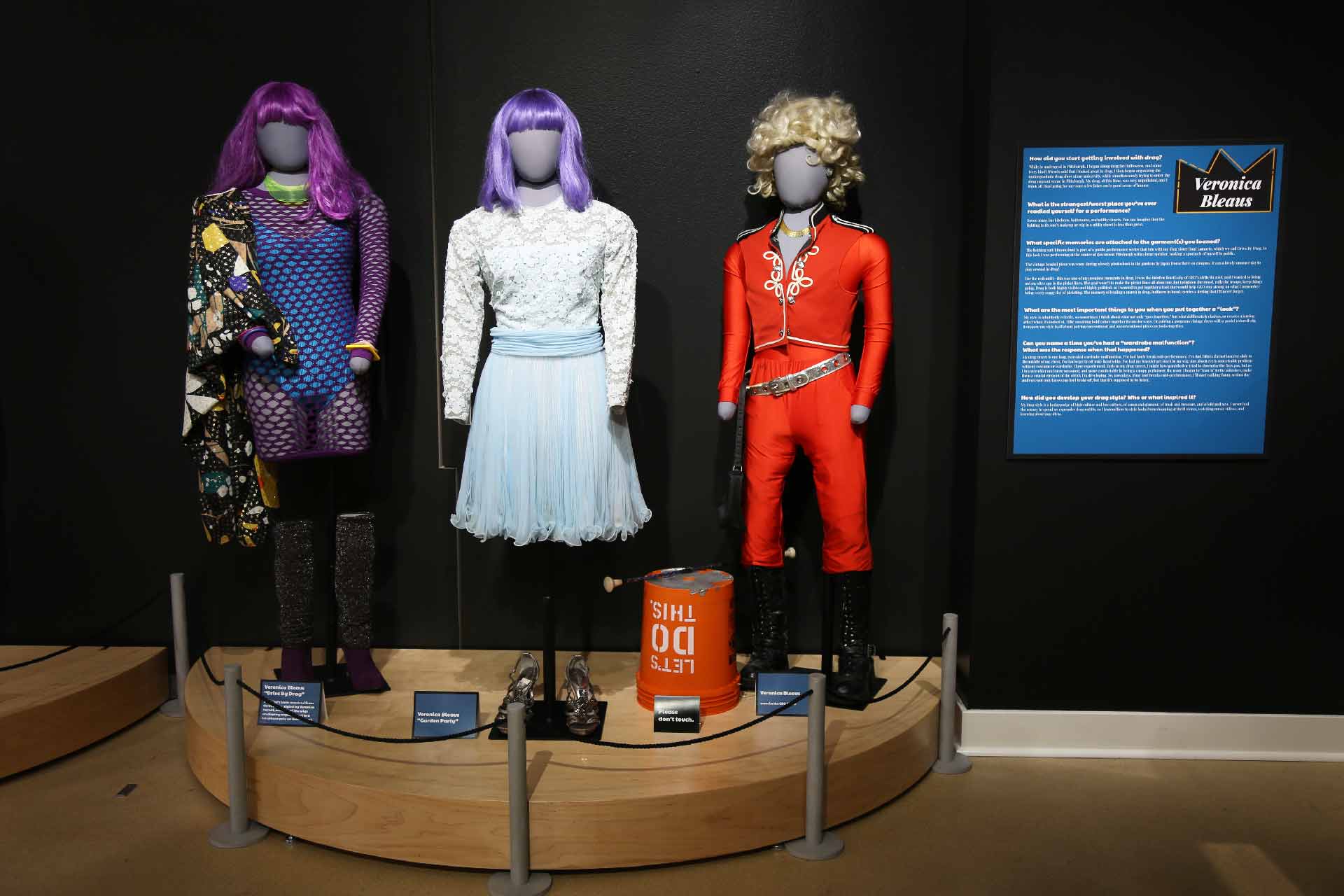 three mannequins in drag on display