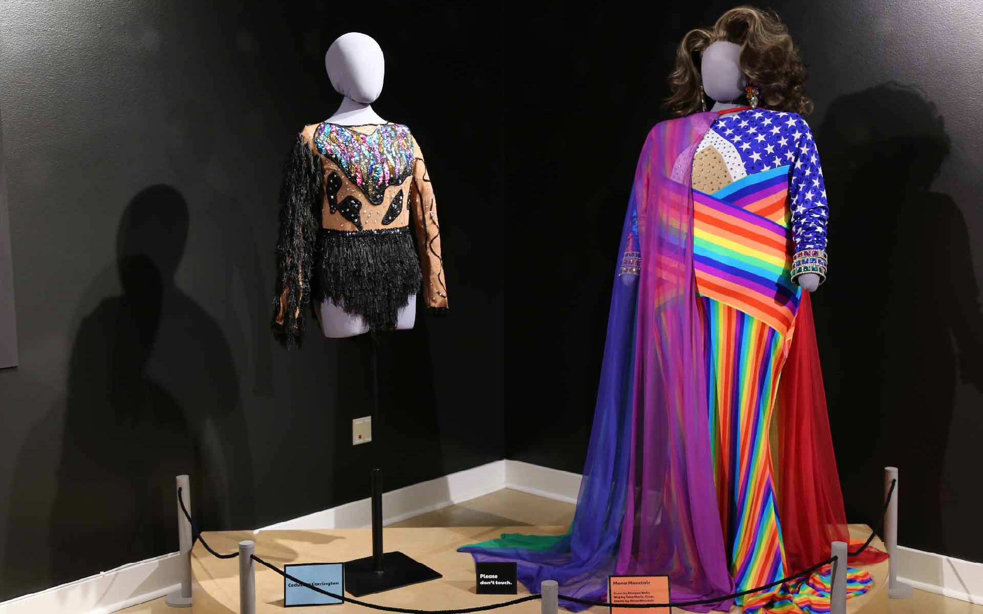 2 mannequins dressed in colorful drag outfits