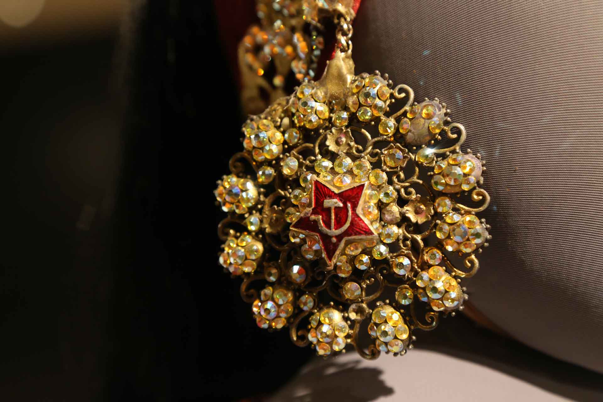 Close up of gold earring on mannequin