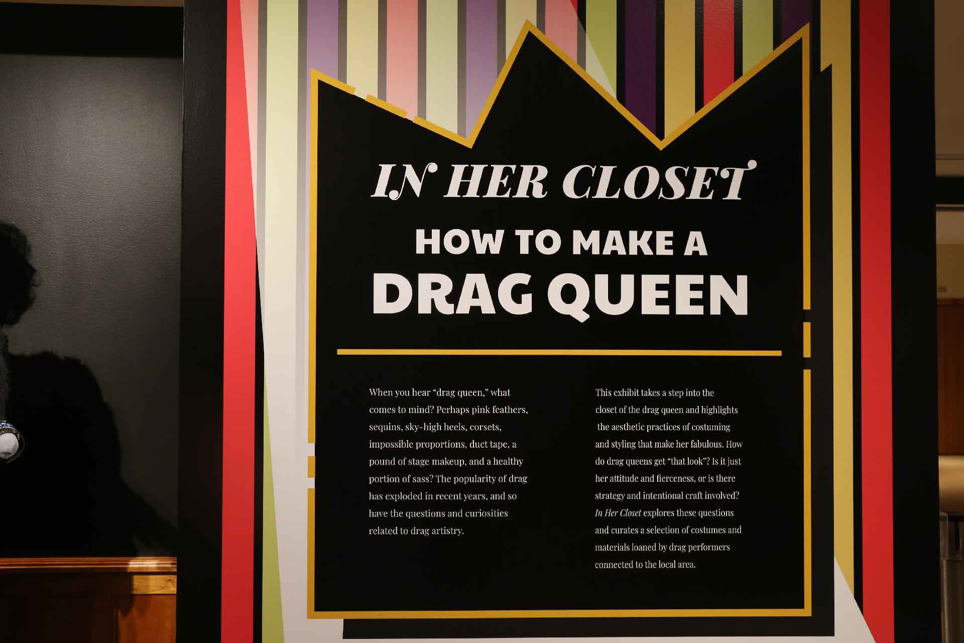 Black wall label with white text about exhibit