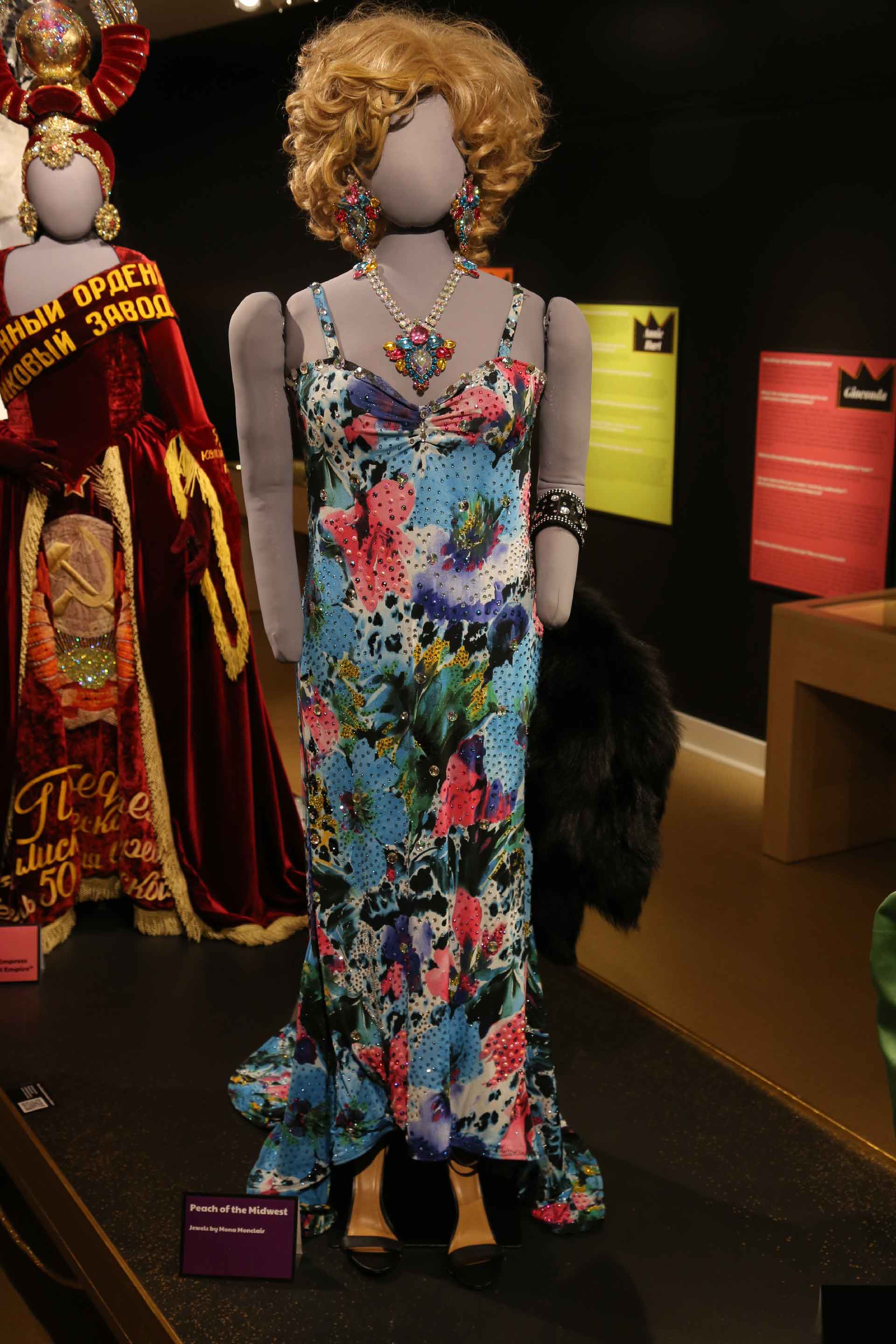 Mannequin in light blue dress with colorful flowers