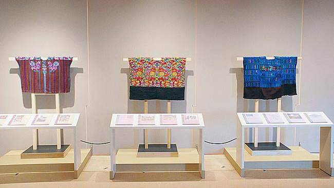 alternate view of woven blouses, claret, orange and blue