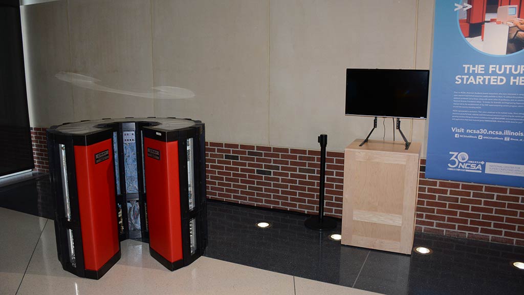 cray red and black cylindrical computer system