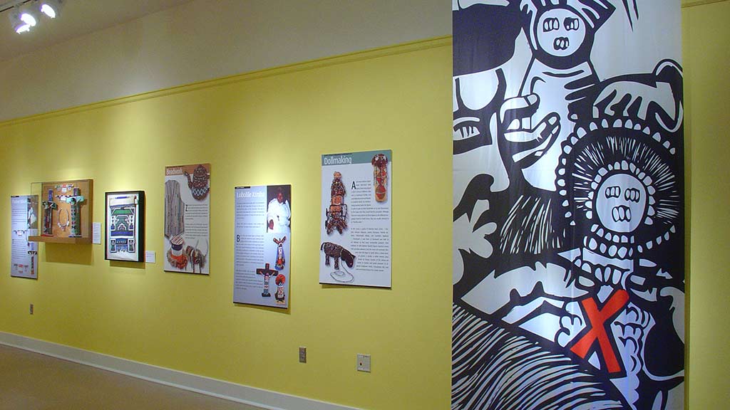 wall of posters and text descriptions