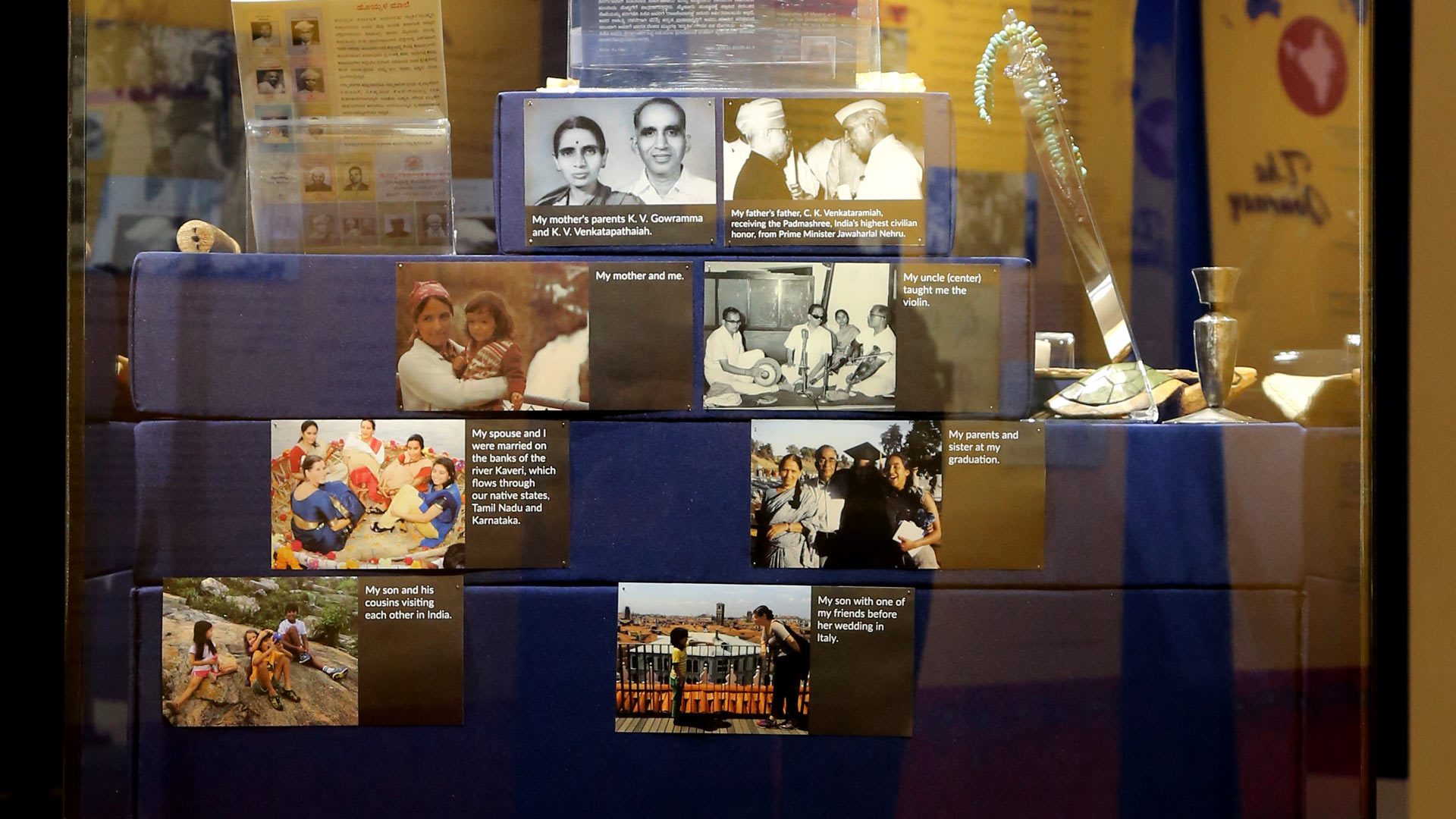 display case containing many pictures of people, presumably related to Dr. Koeli Goel