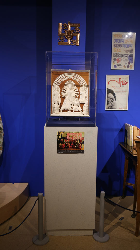 an art piece in a display case with a picture under