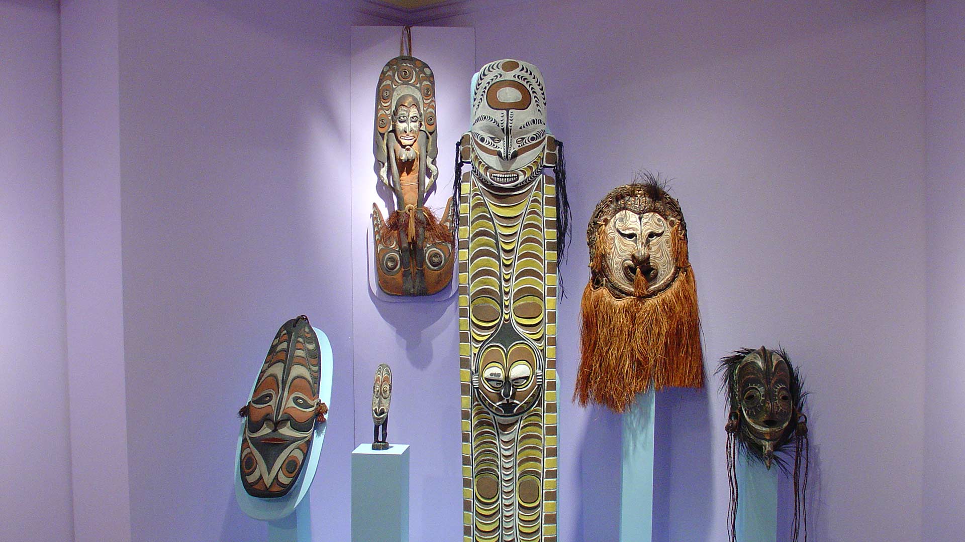 more cenetered view of the faces on masks and figures