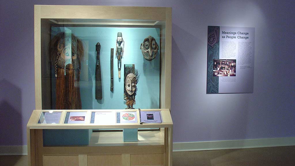 another display case of face masks and figures