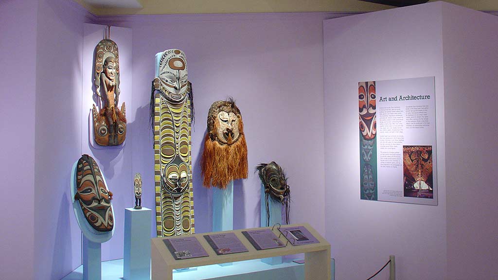 angled view of faces on masks and figures