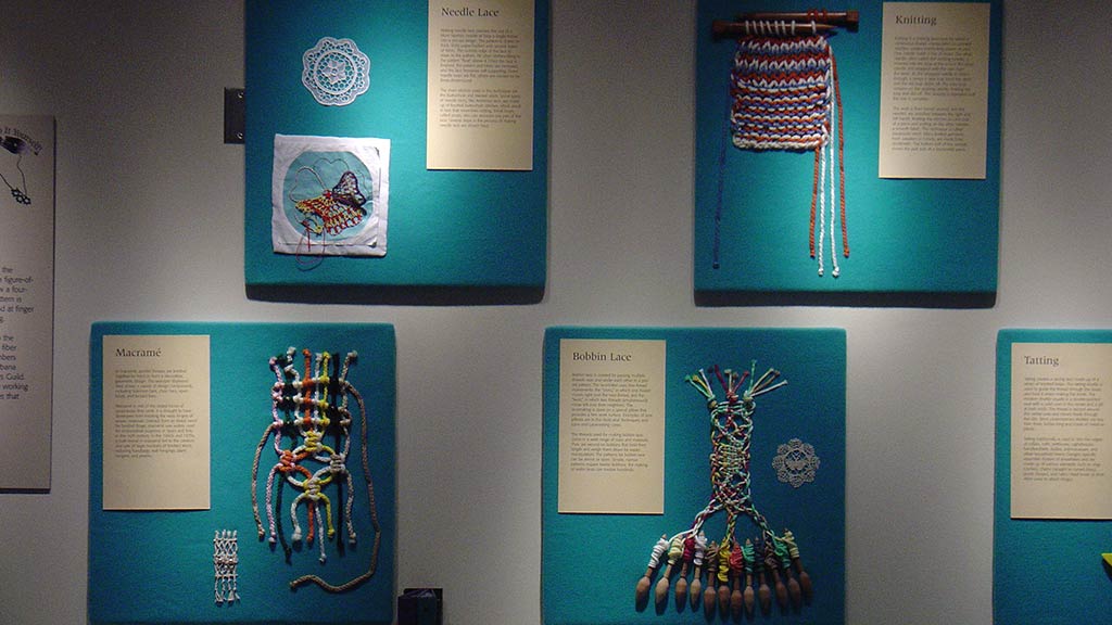 close up of intricate and colorful knots with associated text