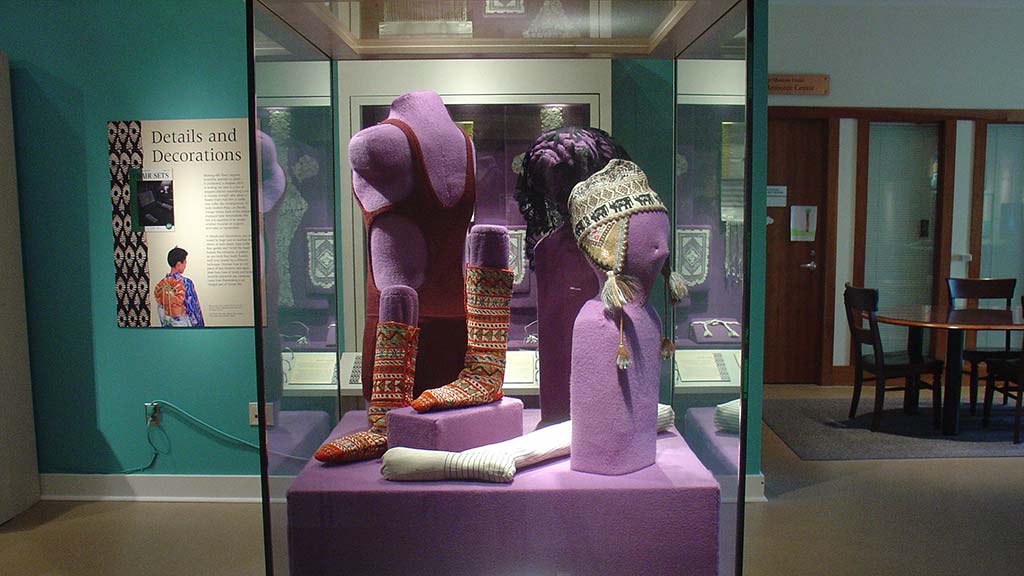 headdress, socks with intricate embroiery, vest